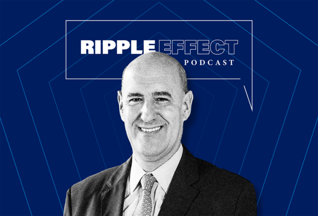 Headshot of a smiling person in a suit against a blue geometric background with text that reads "Ripple Effect Podcast."